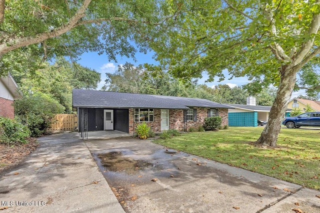 216 Buena Vista Dr, Long Beach, MS 39560 - ranch-style home with a chimney, brick siding, fence, driveway, and a front lawn
