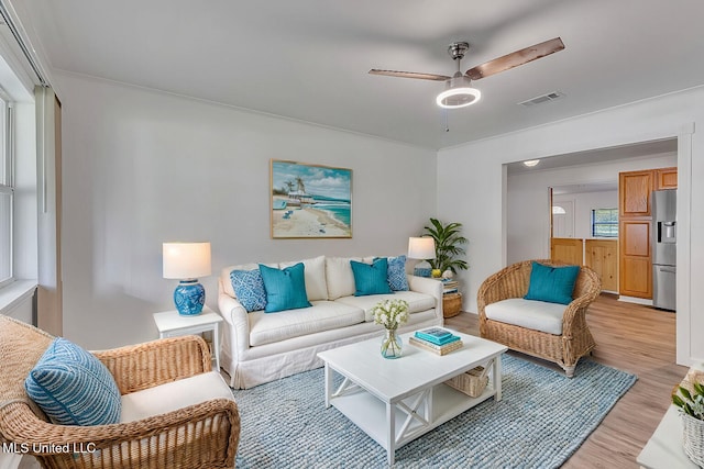 216 Buena Vista Dr, Long Beach, MS 39560 - living area featuring a ceiling fan, visible vents, and light wood-type flooring