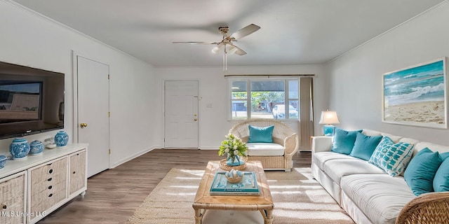 216 Buena Vista Dr, Long Beach, MS 39560 - living area with baseboards, wood finished floors, a ceiling fan, and crown molding