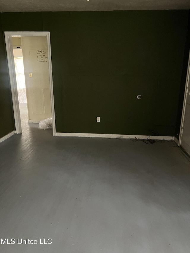 731 Hillmont Dr, Jackson, MS 39209 - spare room featuring finished concrete floors and baseboards