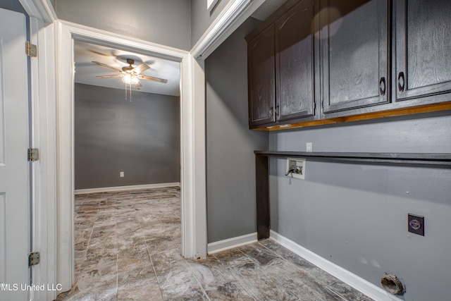 laundry room with cabinet space, a ceiling fan, hookup for an electric dryer, baseboards, and washer hookup