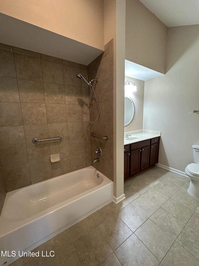 full bath with shower / bathtub combination, toilet, vanity, tile patterned flooring, and baseboards