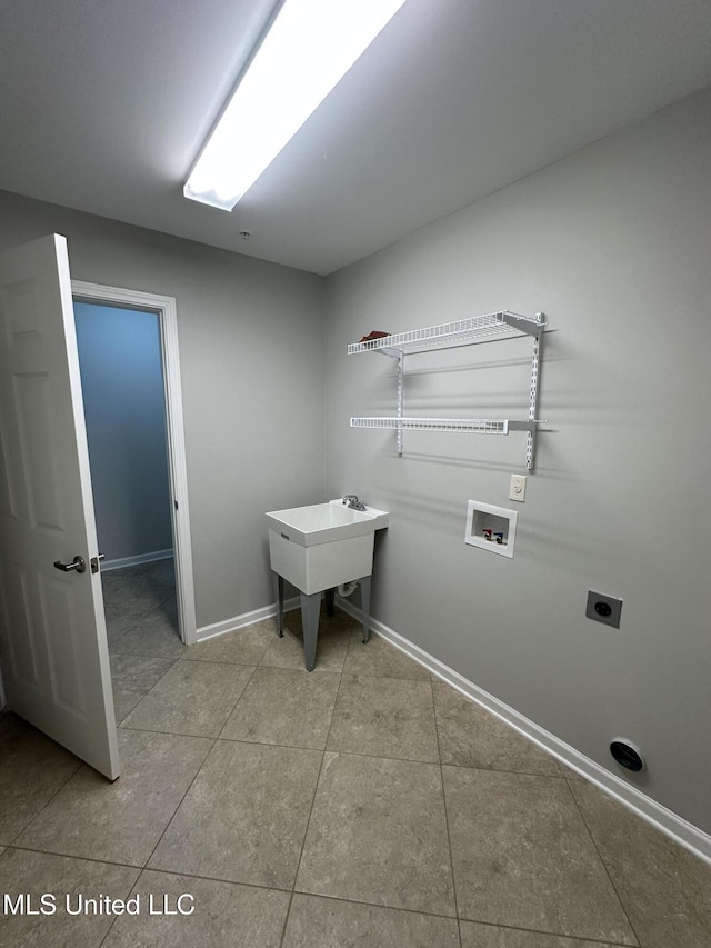 laundry room with laundry area, baseboards, tile patterned floors, hookup for a washing machine, and electric dryer hookup