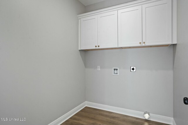 laundry area featuring dark wood-style floors, hookup for a washing machine, cabinet space, hookup for an electric dryer, and baseboards