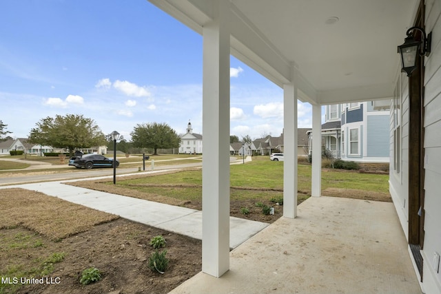 view of patio with a residential view and a porch