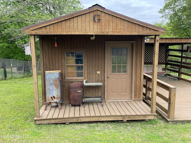 view of outbuilding with a lawn