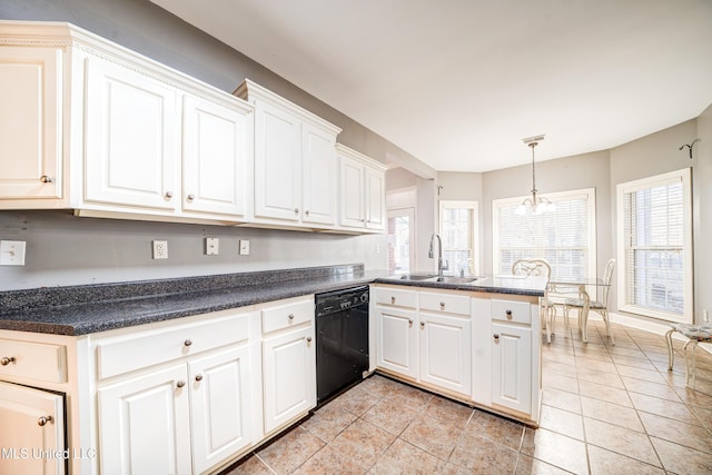 9480 Miranda Dr, Olive Branch, MS 38654 - kitchen with dishwasher, a peninsula, dark countertops, white cabinets, and healthy amount of natural light