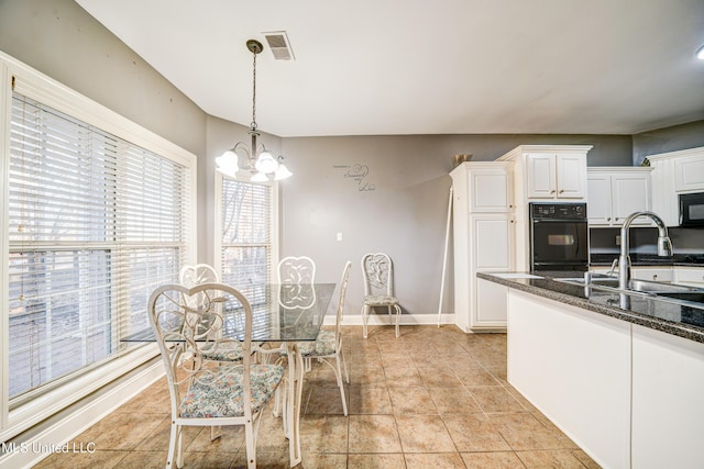 9480 Miranda Dr, Olive Branch, MS 38654 - dining space with plenty of natural light and a chandelier