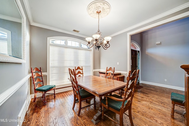 9480 Miranda Dr, Olive Branch, MS 38654 - dining room with wood finished floors, a chandelier, and crown molding