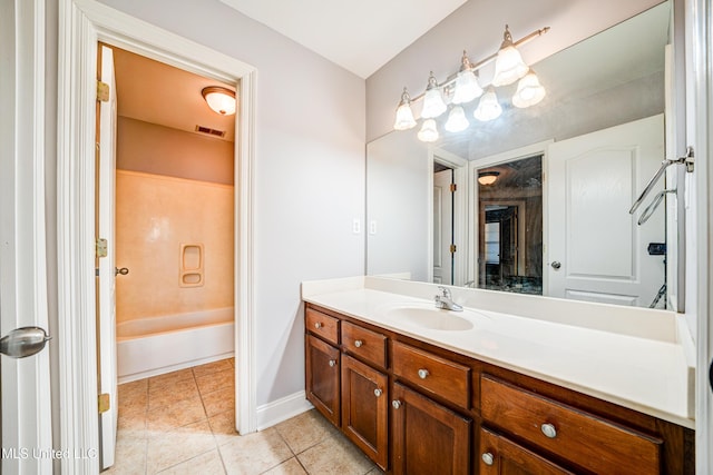 9480 Miranda Dr, Olive Branch, MS 38654 - full bathroom featuring vanity, tile patterned floors, and a bathtub