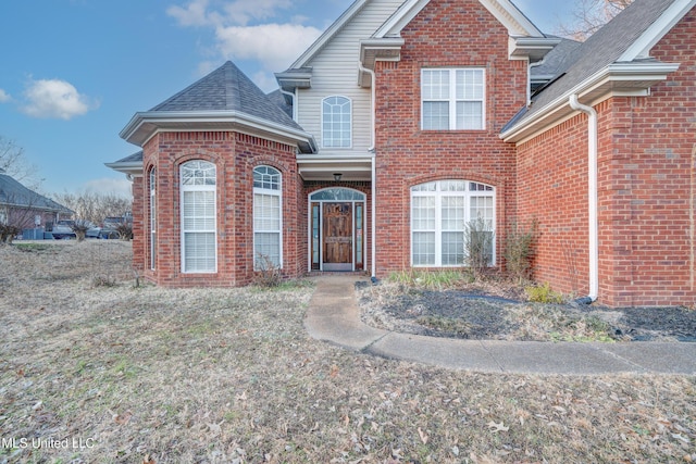 9480 Miranda Dr, Olive Branch, MS 38654 - traditional-style house featuring brick siding and a shingled roof