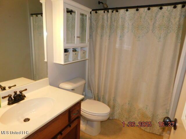 full bathroom with vanity, toilet, and shower / bath combo with shower curtain