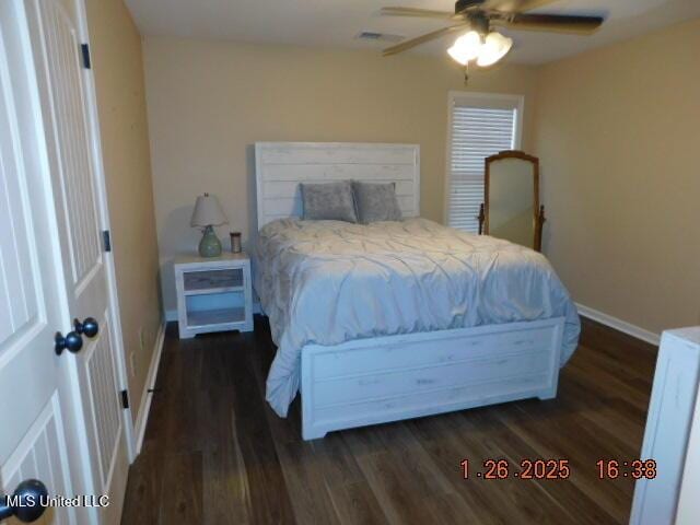 bedroom featuring dark hardwood / wood-style floors and ceiling fan