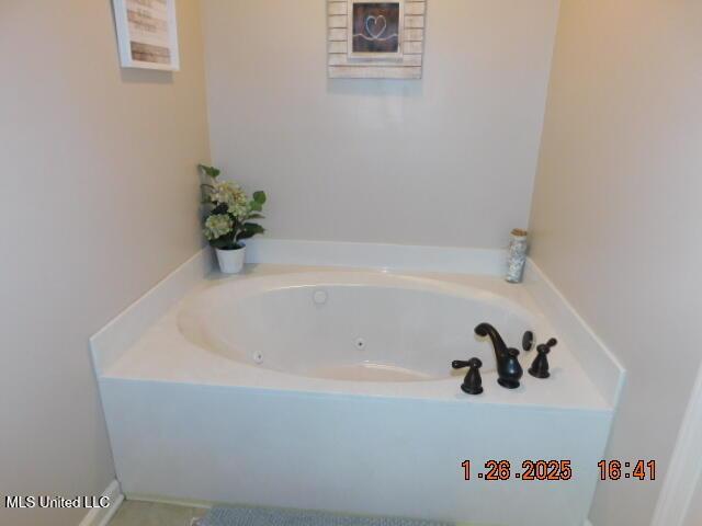 bathroom featuring a tub to relax in