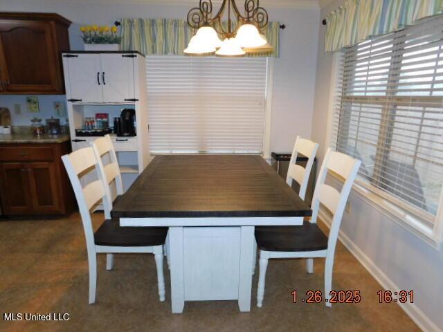 dining room featuring a chandelier