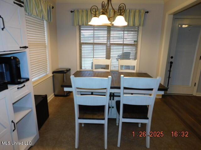 dining space featuring an inviting chandelier