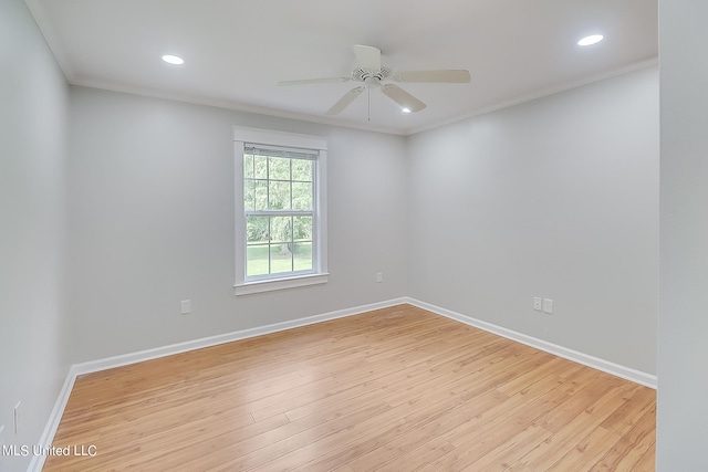 unfurnished room featuring light hardwood / wood-style flooring, ornamental molding, and ceiling fan