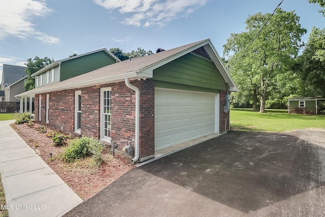 garage with a yard