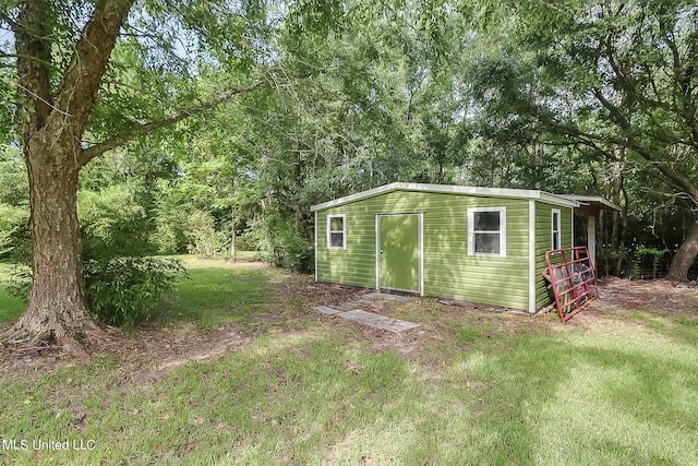 view of outdoor structure featuring a yard