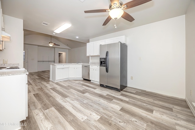 kitchen featuring extractor fan, white cabinetry, vaulted ceiling, kitchen peninsula, and stainless steel appliances