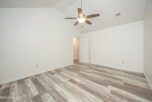 spare room featuring ceiling fan, high vaulted ceiling, and light hardwood / wood-style flooring