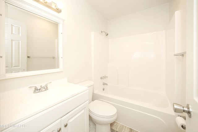 full bathroom with shower / tub combination, vanity, and toilet