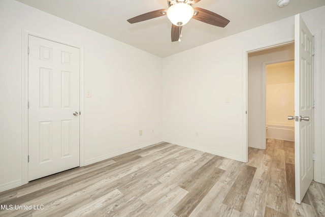 spare room featuring ceiling fan and light wood-type flooring