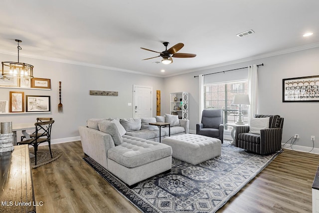 118 Armand Oaks, Ocean Springs, MS 39564 - living room with baseboards, crown molding, ceiling fan, a chandelier, and wood finished floors
