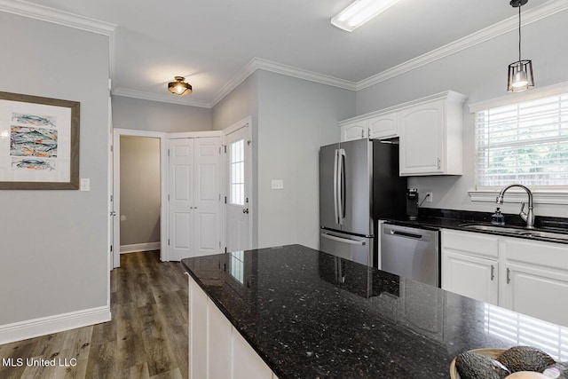 118 Armand Oaks, Ocean Springs, MS 39564 - kitchen with stainless steel appliances, a sink, white cabinetry, dark wood-style flooring, and dark stone counters