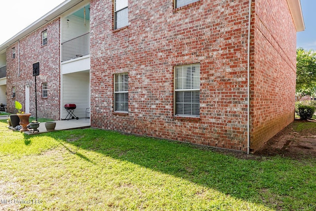 118 Armand Oaks, Ocean Springs, MS 39564 - view of property exterior featuring brick siding, a yard, and a patio