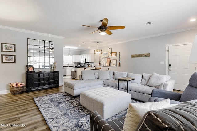118 Armand Oaks, Ocean Springs, MS 39564 - living area with a ceiling fan, wood finished floors, ornamental molding, baseboards, and recessed lighting