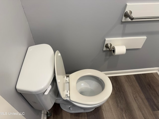 bathroom featuring toilet and hardwood / wood-style flooring