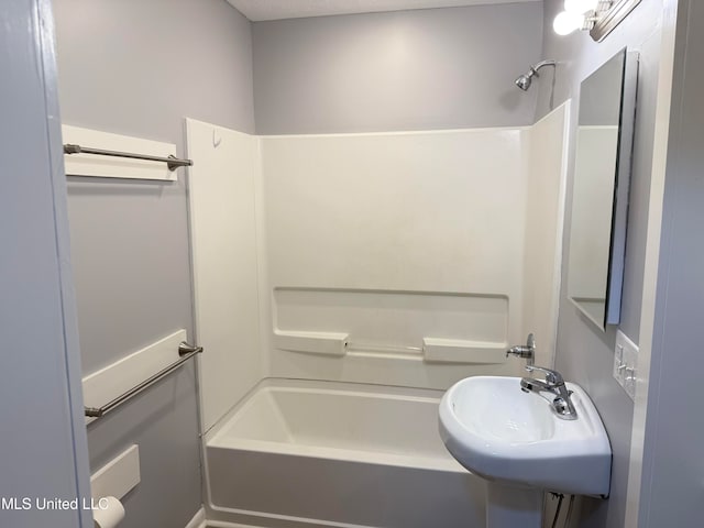 bathroom with sink and shower / bathtub combination