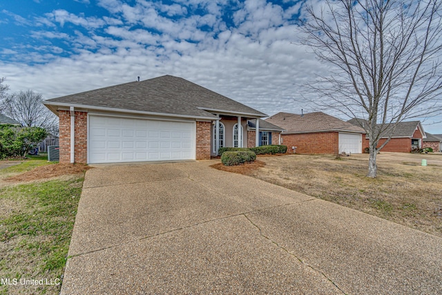 view of front facade featuring cooling unit, a front yard, and a garage