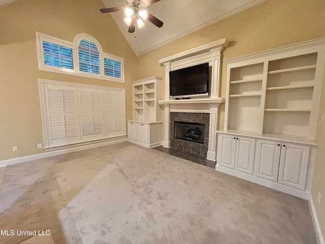 unfurnished living room with a fireplace, carpet floors, ceiling fan, crown molding, and high vaulted ceiling