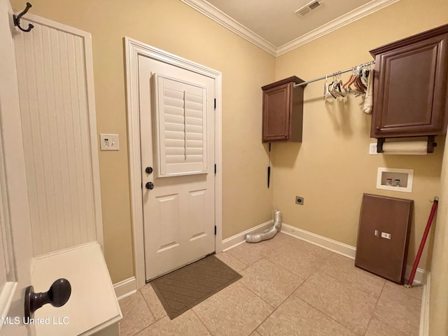 laundry room featuring hookup for a washing machine, light tile patterned floors, crown molding, electric dryer hookup, and cabinets