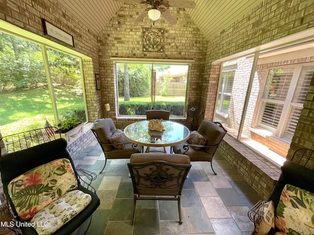 sunroom with vaulted ceiling and ceiling fan