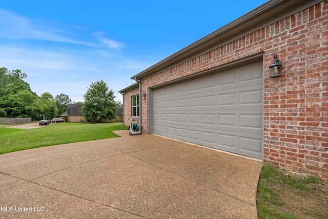 garage featuring concrete driveway