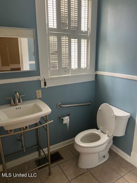 bathroom with tile patterned floors, sink, and toilet