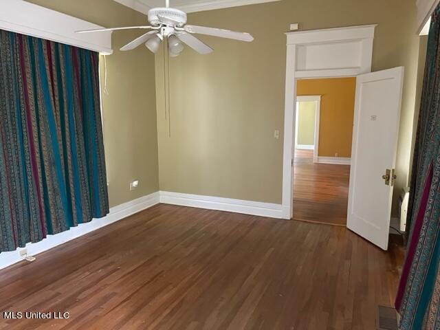 unfurnished room featuring ceiling fan and dark hardwood / wood-style flooring