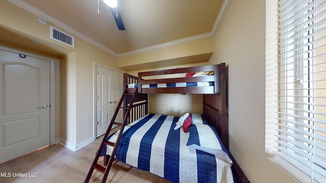 bedroom featuring ornamental molding and ceiling fan