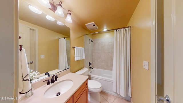 full bathroom featuring vanity, tile patterned floors, toilet, and shower / bathtub combination with curtain