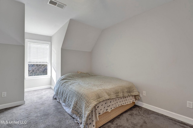 bedroom featuring carpet and lofted ceiling