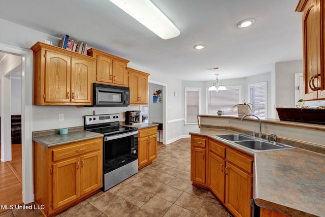 kitchen featuring sink, an inviting chandelier, stainless steel electric range oven, hanging light fixtures, and light tile patterned flooring