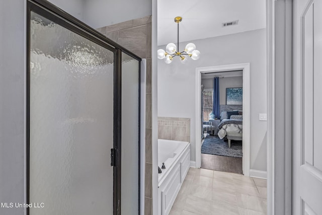 bathroom featuring a stall shower, visible vents, ensuite bath, a chandelier, and a bath