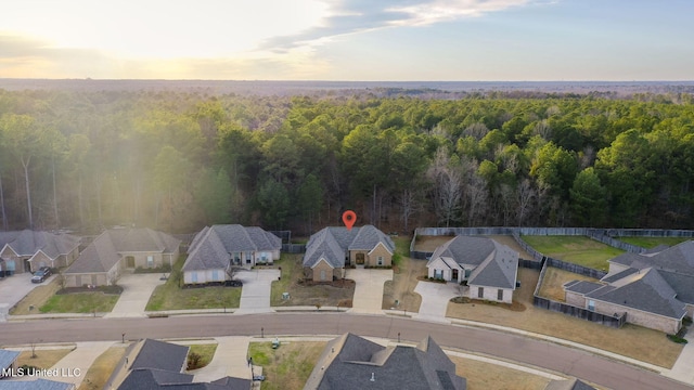 bird's eye view featuring a residential view and a view of trees