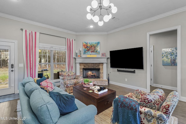 living area with ornamental molding, wood finished floors, and a healthy amount of sunlight