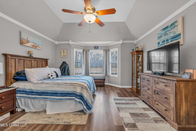 bedroom with ceiling fan, hardwood / wood-style flooring, ornamental molding, and lofted ceiling