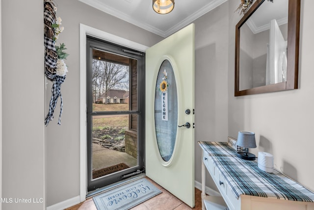 tiled foyer entrance featuring ornamental molding