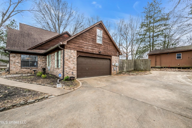 view of side of home featuring a garage